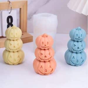 velas en forma de calabazas triples